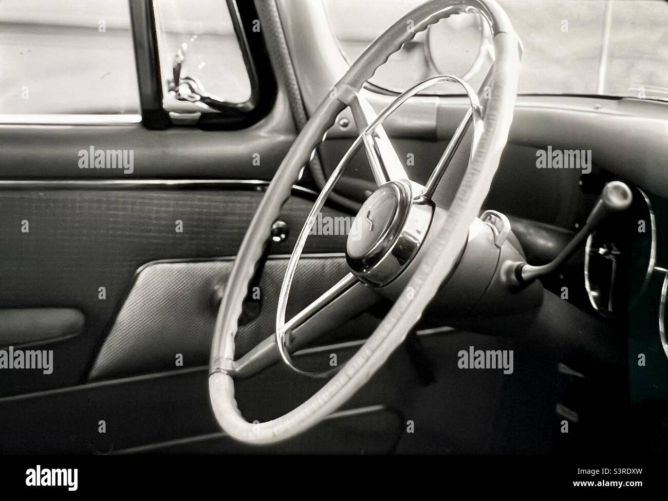 Car steering wheel and dashboard classic Studebaker car mid century modern Automotive design Stock Photo