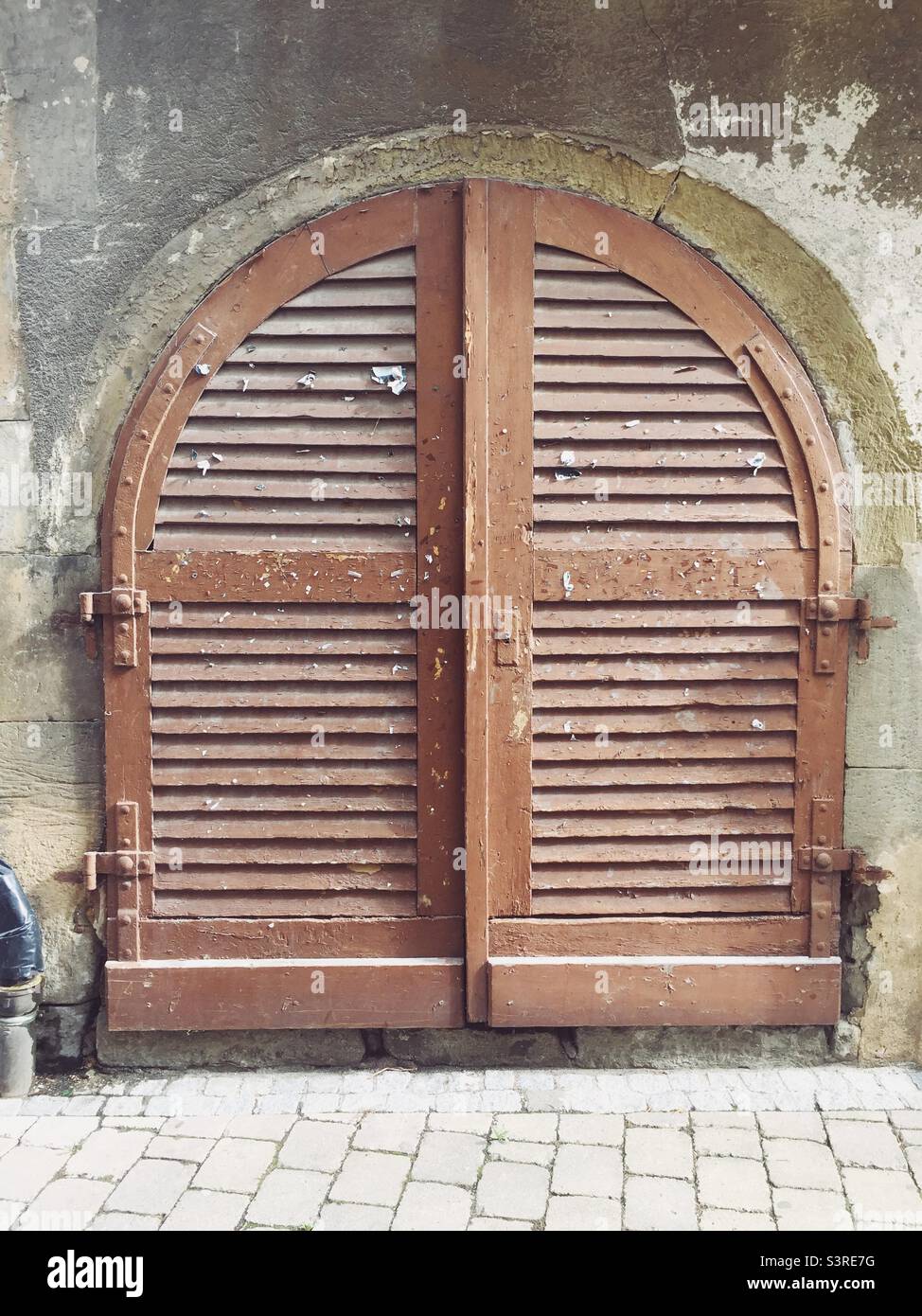 Old weathered wooden gate in medieval town - Smartphone Captured Stock Image