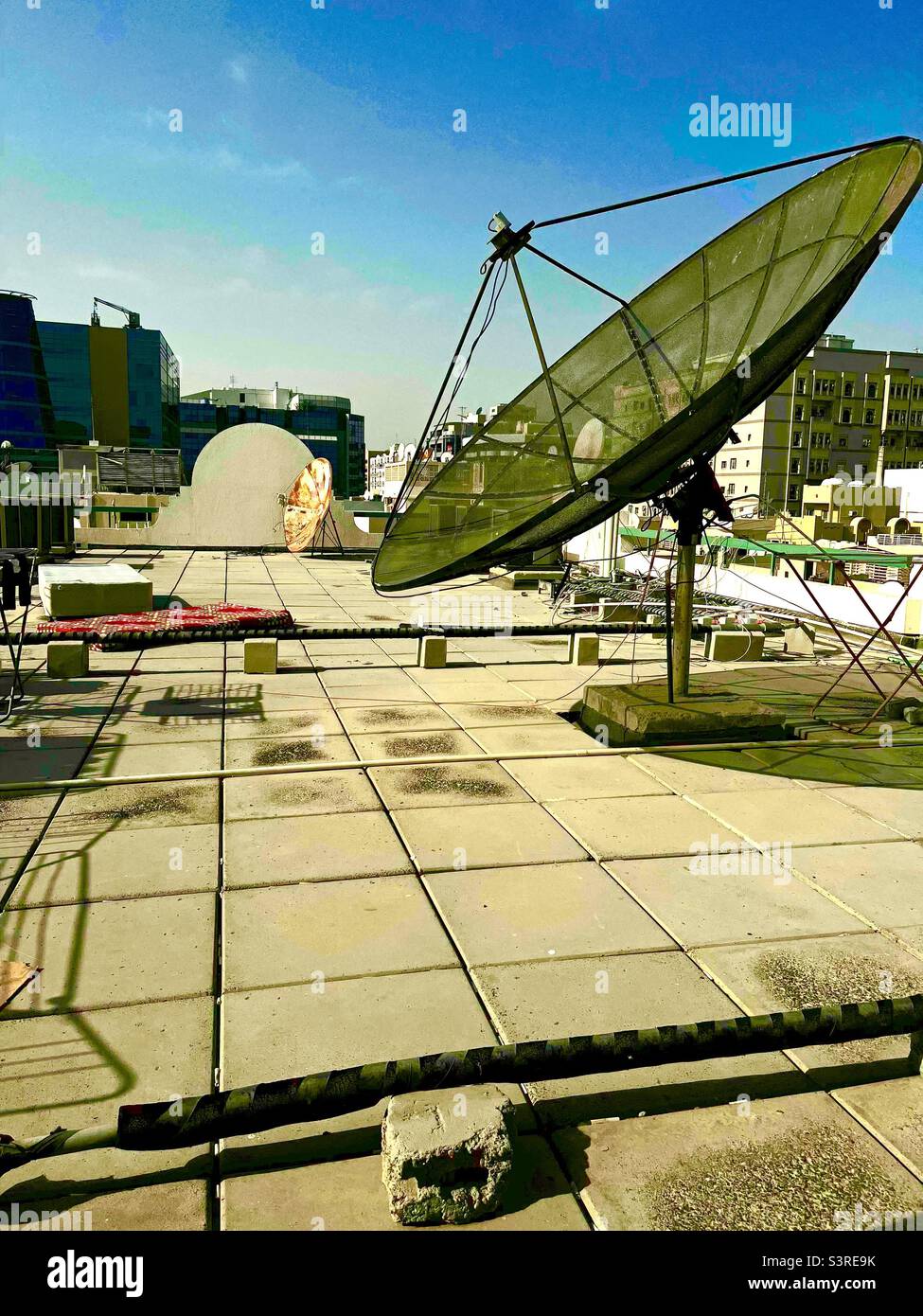Rooftop of an old building in Dubai. Big satellite dish is not in use