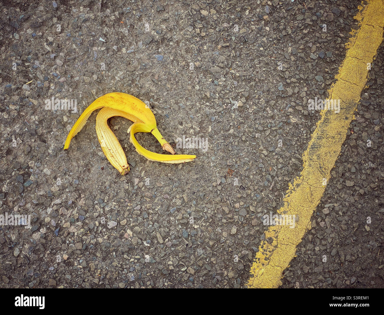 BEWARE - TRIP HAZARD. A discarded banana skin could cause a slip or fall if you accidentally step on it. Keep your eyes peeled! Photo ©️ COLIN HOSKINS. - Smartphone Captured Stock Image