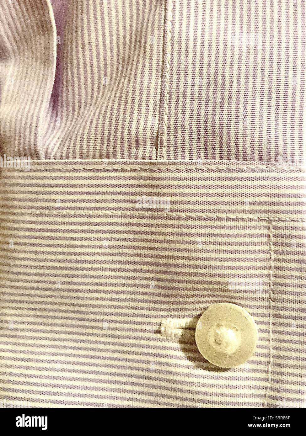 Lavender stripe Oxford shirt sleeve showing cuff with button detail - Smartphone Captured Stock Image