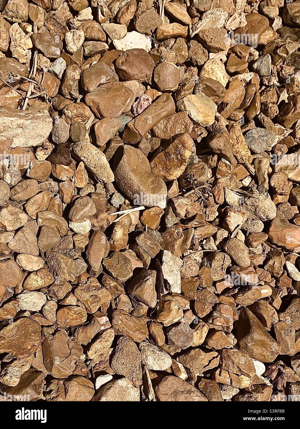 Brown and tan river rock background - Smartphone Captured Stock Image