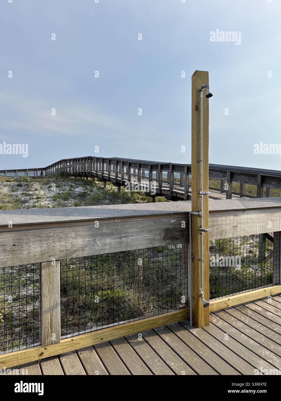 Outdoor public shower area at Henderson Beach State Park Florida - Smartphone Captured Stock Image