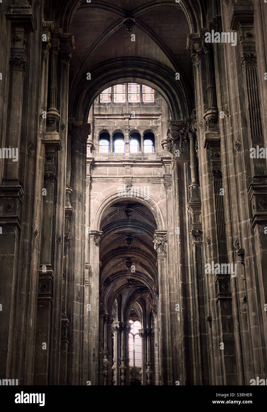 Gothic arched stone interior of St-Eustache church in Paris, France Stock Photo