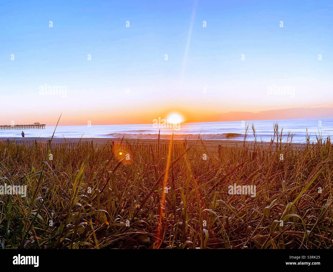 Beach sunrise. Myrtle beach sunrise. South Carolina sunrise. Breathtaking sunrise. Beautiful sunrise. - Smartphone Captured Stock Image