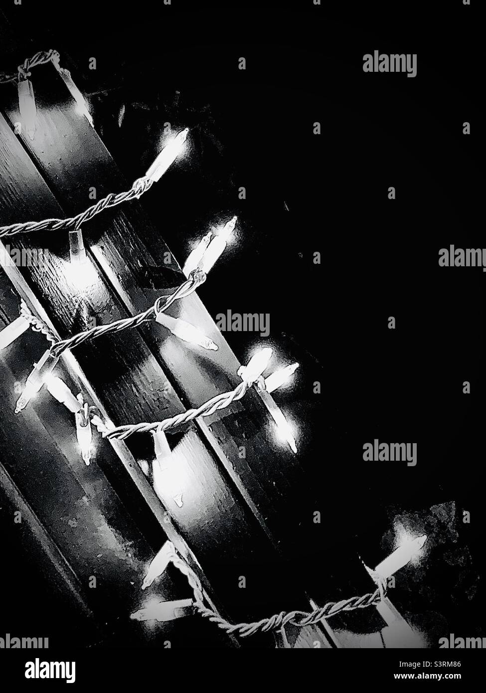 Simple black and white holiday lights with negative space - Smartphone Captured Stock Image