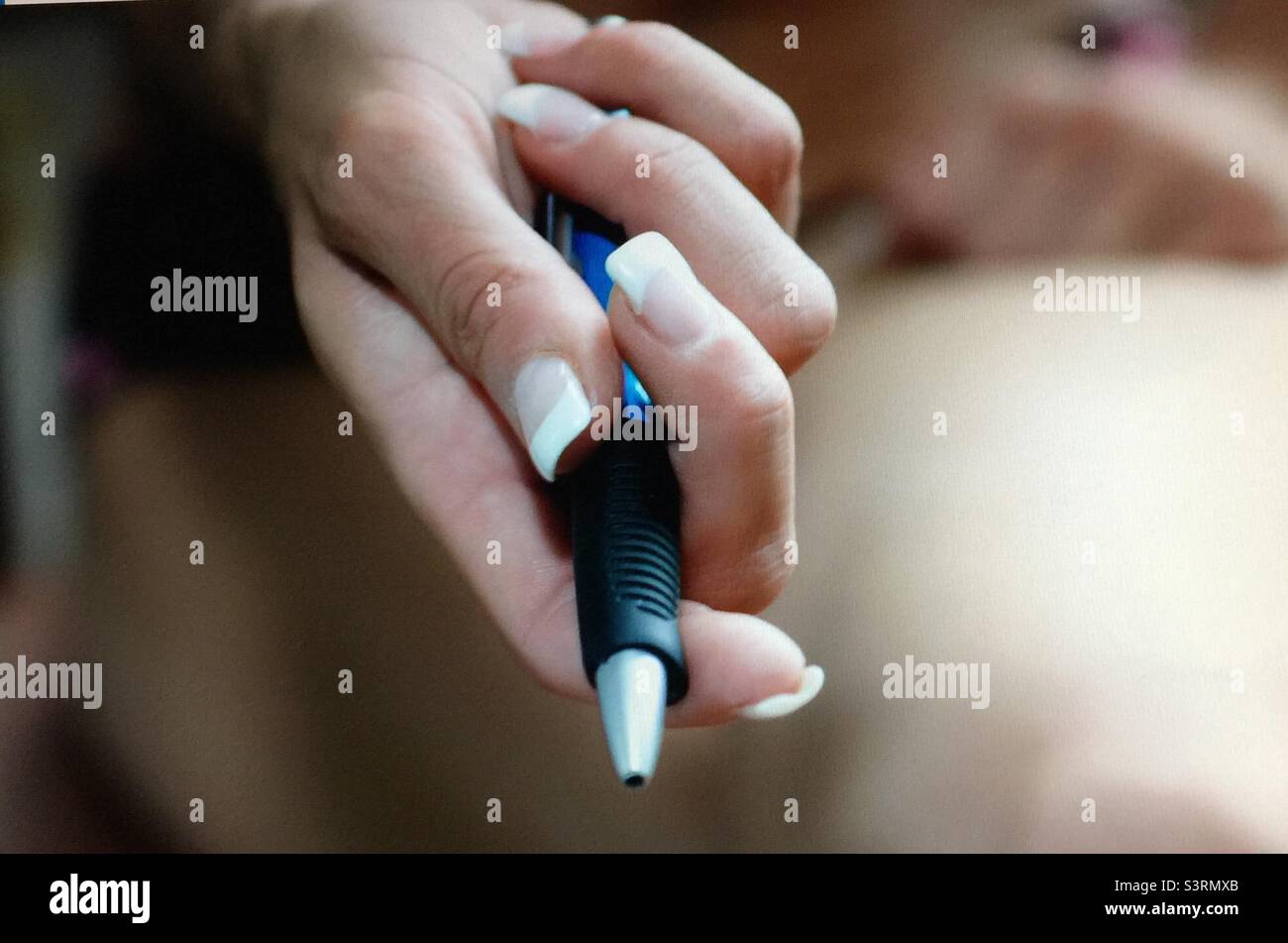 Pen in hand, woman’s hand, pen, ball point pen, manicured hand, Stock Photo