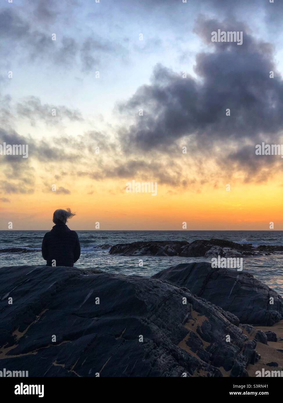 Admiring the sunset from the beach - Smartphone Captured Stock Image