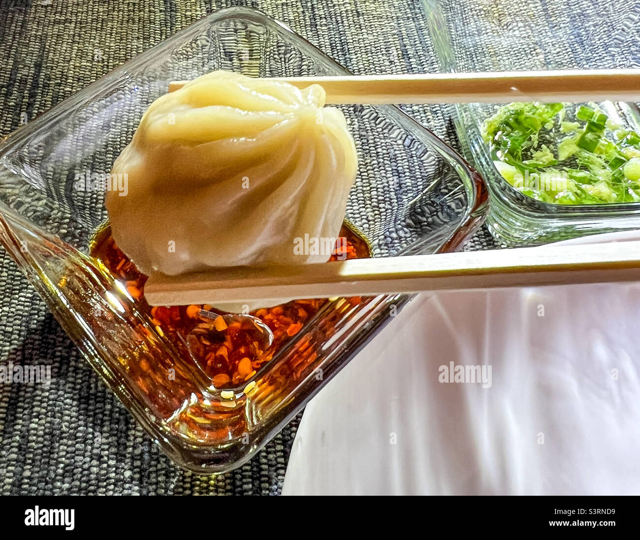 Chinese Soup Dumpling with chili oil Stock Photo