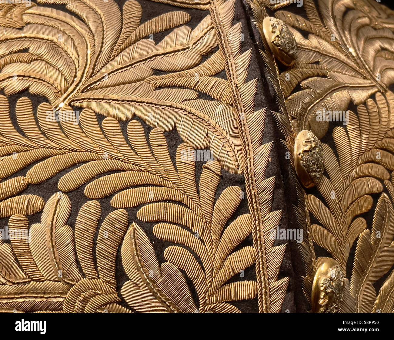 A detail of an elaborately embroidered dress uniform from the 19th century in Plas Newydd Anglesey - Smartphone Captured Stock Image