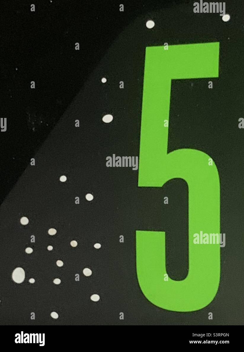 Green number 5 on black background - Smartphone Captured Stock Image