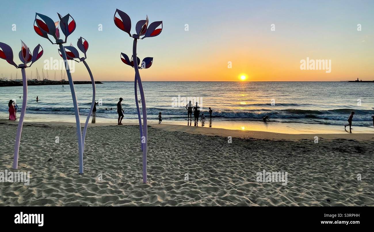Sculpture Wind Dancers by Melanie Maclou at Sculptures at Bathers Beach 2022 at sunset Fremantle