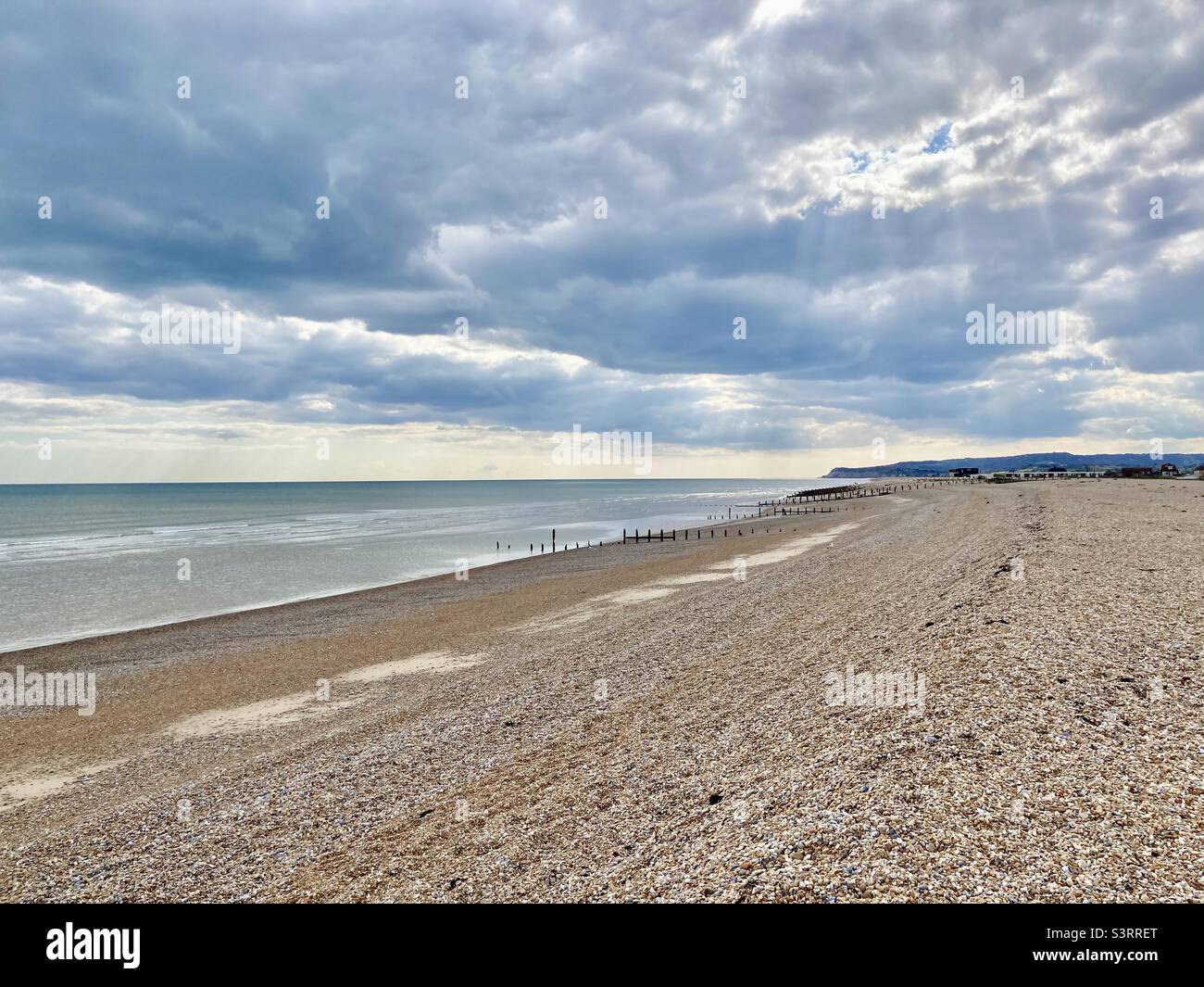 A long stretch of beach on a lovely sunny day - Smartphone Captured Stock Image