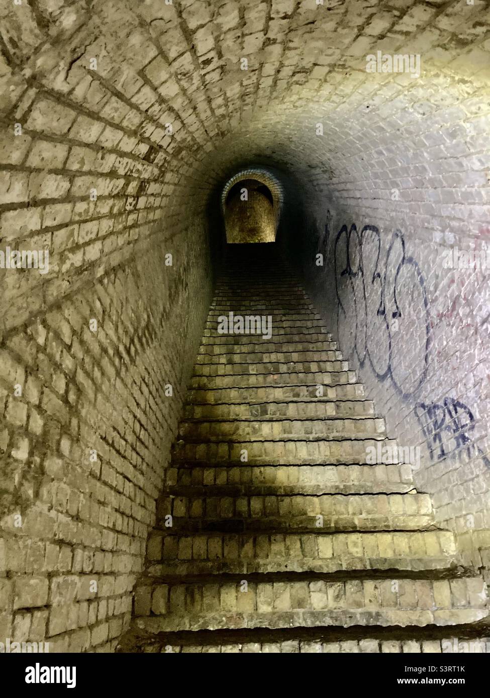 Brick staircase and tunnel in an abandoned military fortification - Smartphone Captured Stock Image
