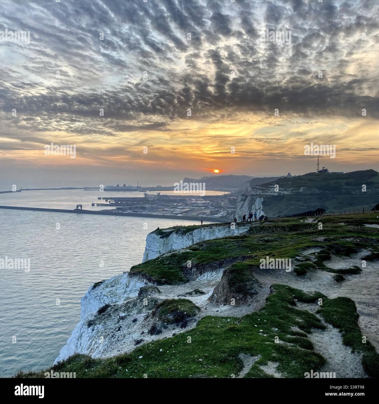 Sunset over Dover harbour  - viewed from the white cliffs Stock Photo