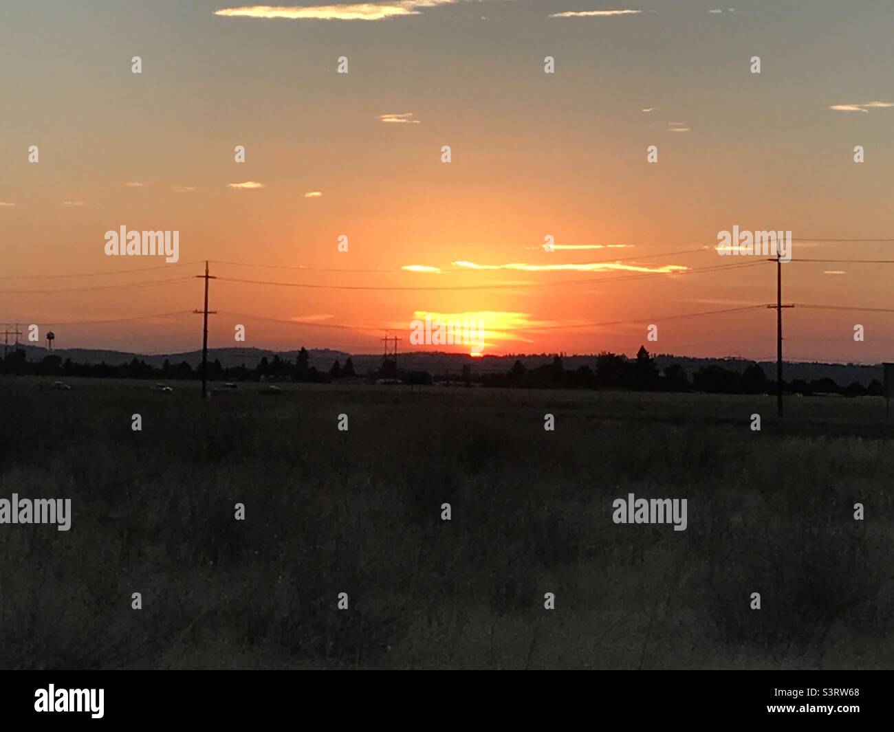 Beautiful fiery orange sunset in the horizon Stock Photo - Alamy