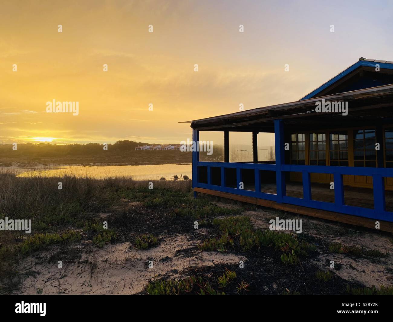 Closed beach cafe at sunset in winter in the Algarve Stock Photo