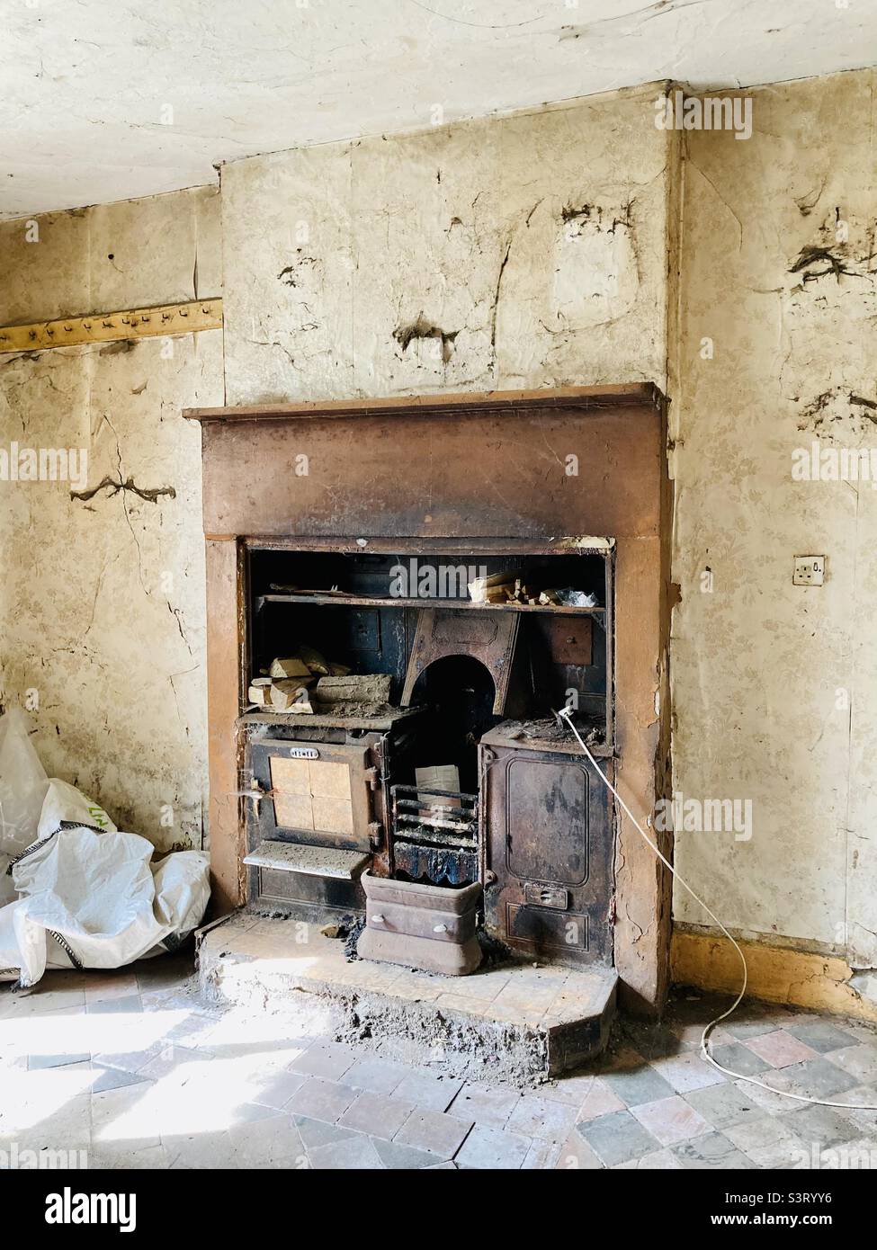 Old fireplace in a derelict farmhouse in Matlock, Derbyshire - Smartphone Captured Stock Image