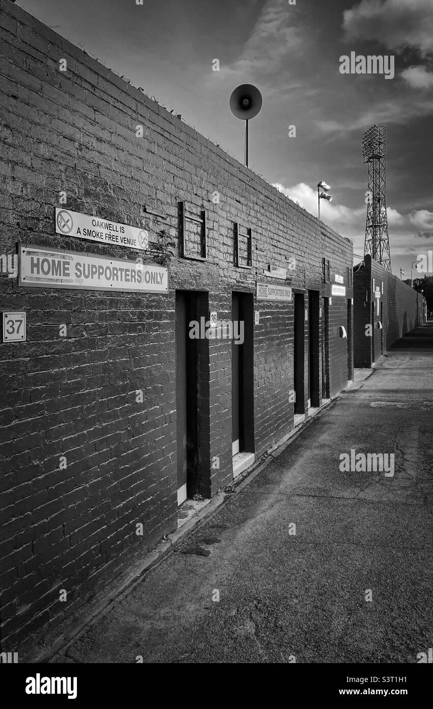 ‘The red wall’ Barnsley FC home ground, Oakwell from outside the old West Stand on a quiet non match day (Black & White) Stock Photo