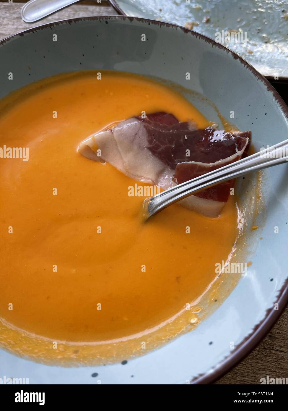 Salmorejo, traditional Andalusian soup served with Iberian ham Stock Photo