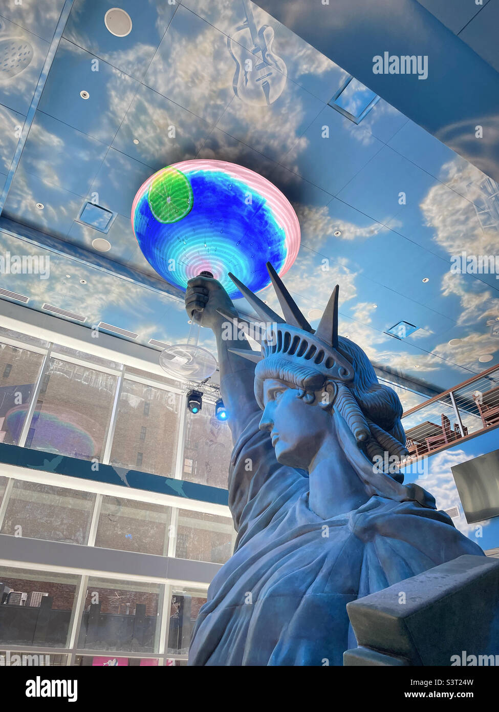 Light show at a giant Statue of Liberty in Jimmy Buffett Margaritaville resort hotel, Times Square, New York City, USA, 2022 - Smartphone Captured Stock Image