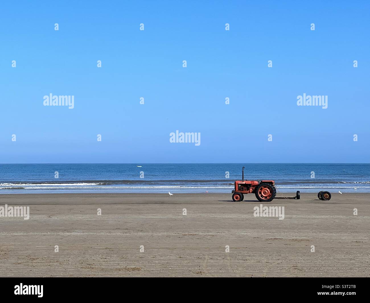 Tractor on a sandy beach - Smartphone Captured Stock Image
