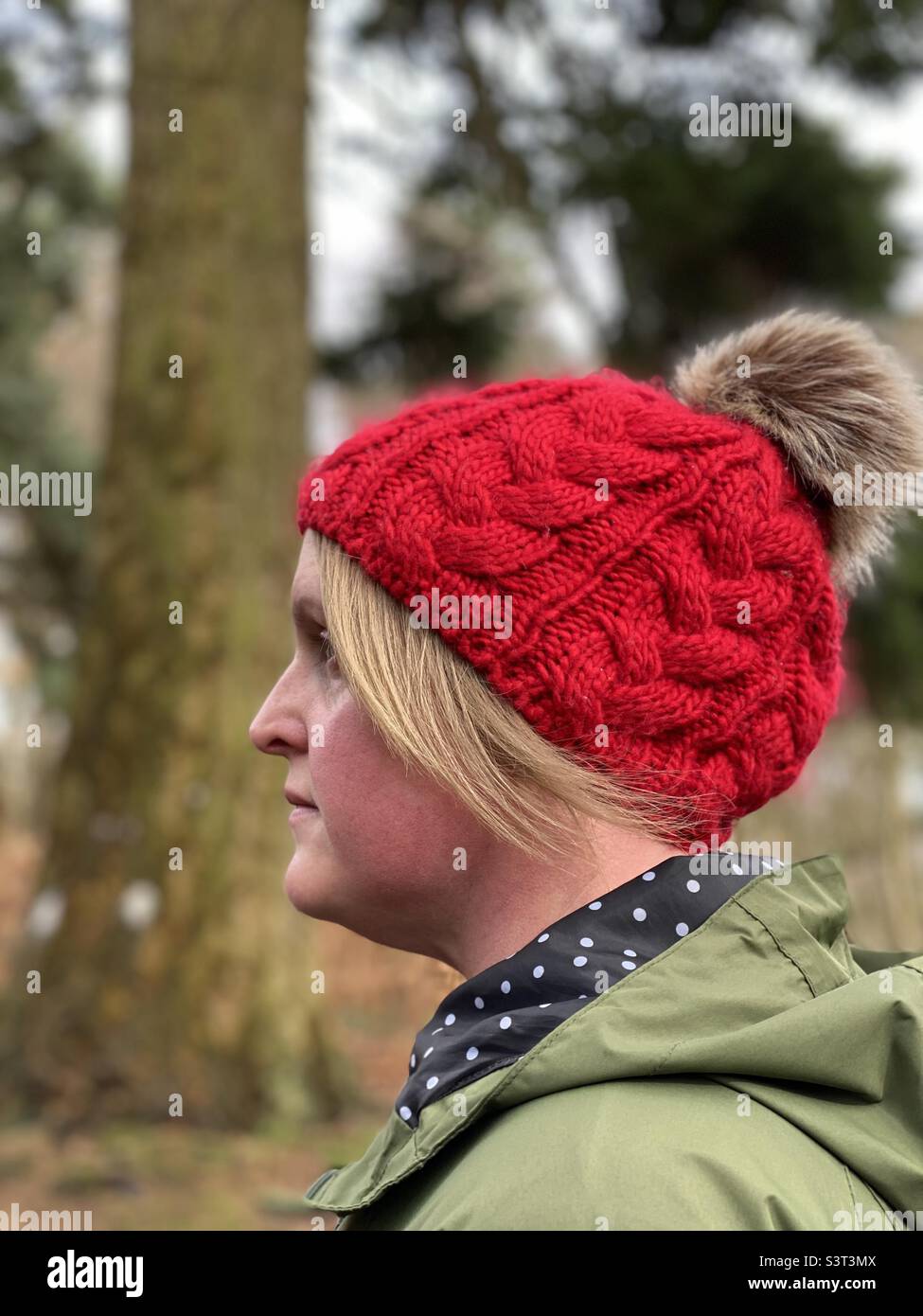 Side view of a woman wearing a knit hat Stock Photo