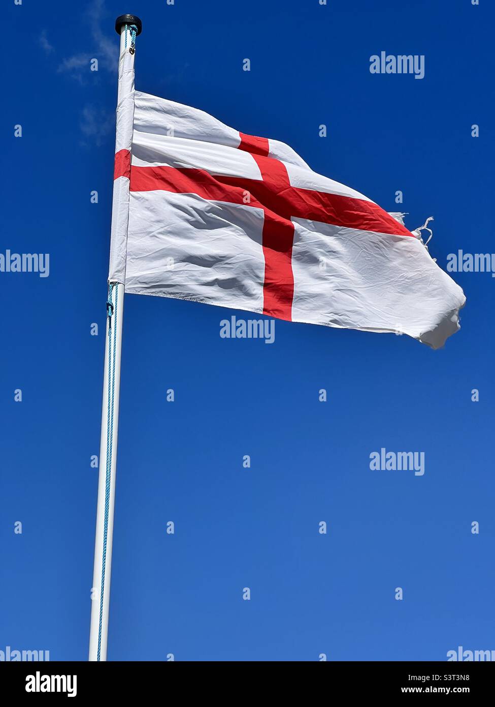 England flag against a clear, blue sky - Smartphone Captured Stock Image