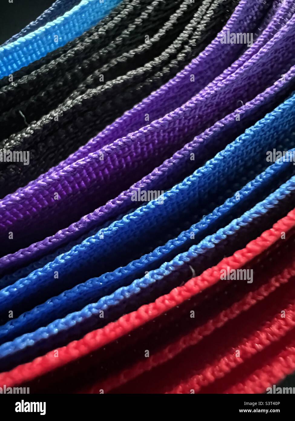 Colorful arrangement zippers curved Stock Photo Alamy