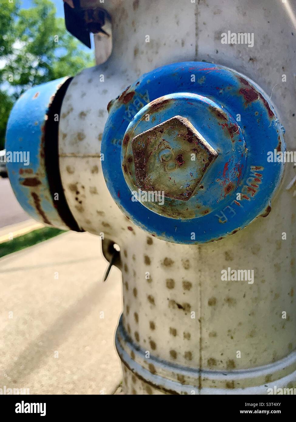 Closeup of rusted silver and blue fire hydrant - Smartphone Captured Stock Image