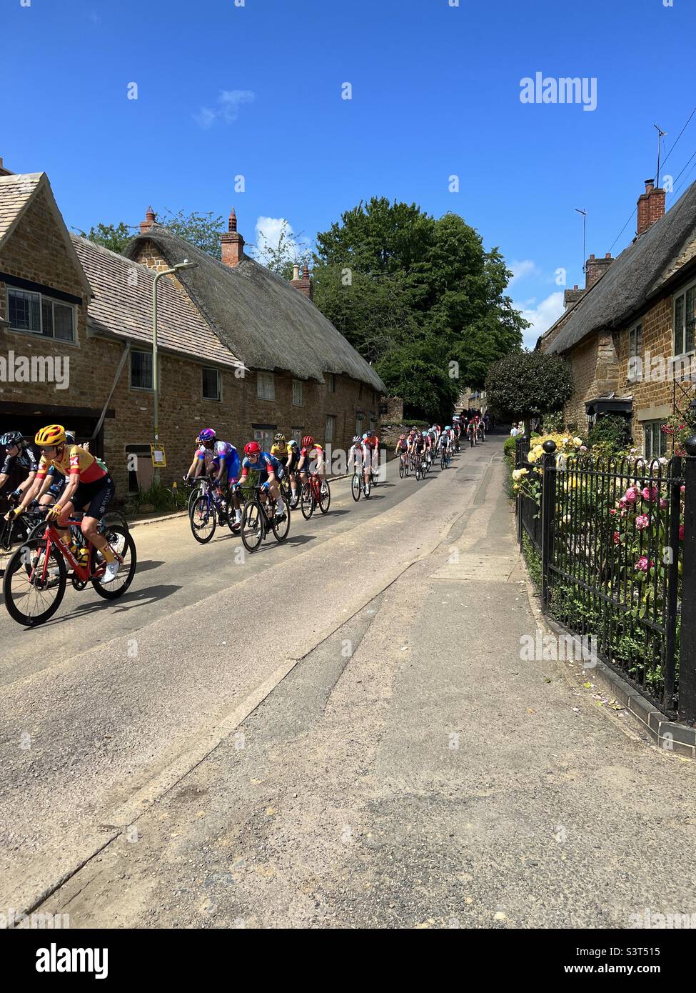 Woman’s Tour 2022. June 11th travels through the picturesque village of Hook Norton on stage 6 - Smartphone Captured Stock Image