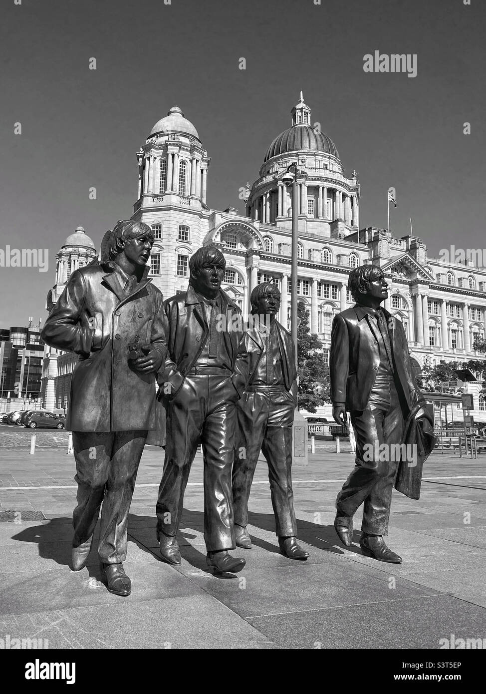 The bronze statues of The Beetles created by Andy Edwards & unveiled in Dec.2015. Situated at the Pier Head outside The Liver Building. Paul McCartney, John Lennon, Ringo Star, George Harrison. ©️ - Smartphone Captured Stock Image