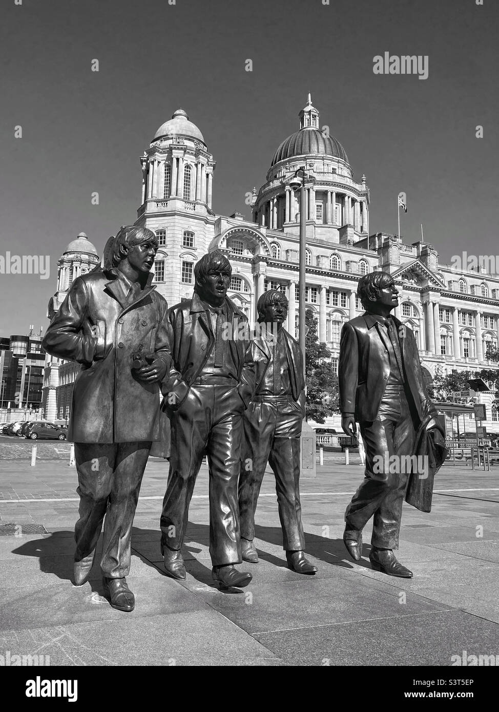 The bronze statues of The Beetles created by Andy Edwards & unveiled in Dec.2015. Situated at the Pier Head outside The Liver Building. Paul McCartney, John Lennon, Ringo Star, George Harrison. ©️ Stock Photo
