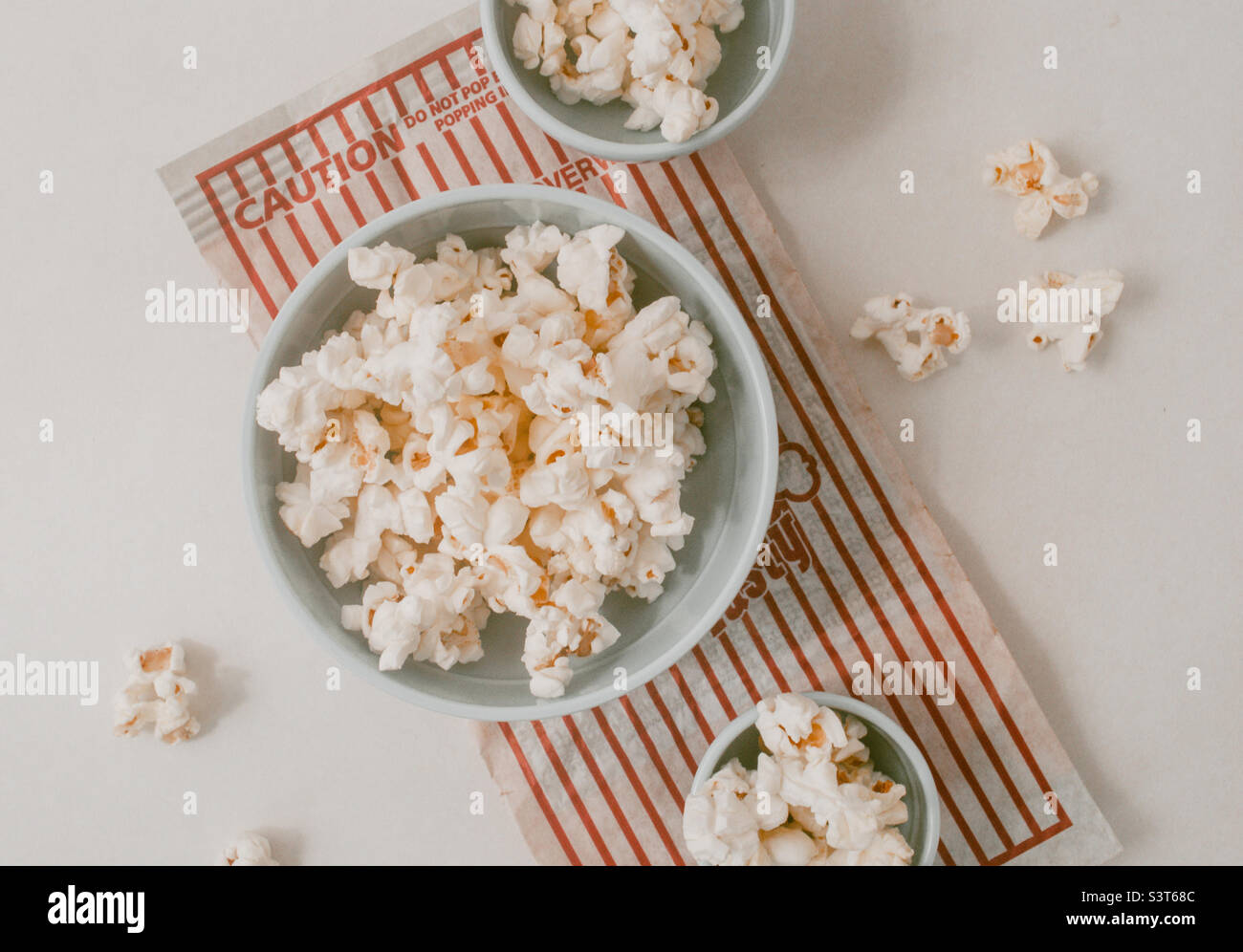 Pop corn in bowls on a white background Stock Photo Alamy
