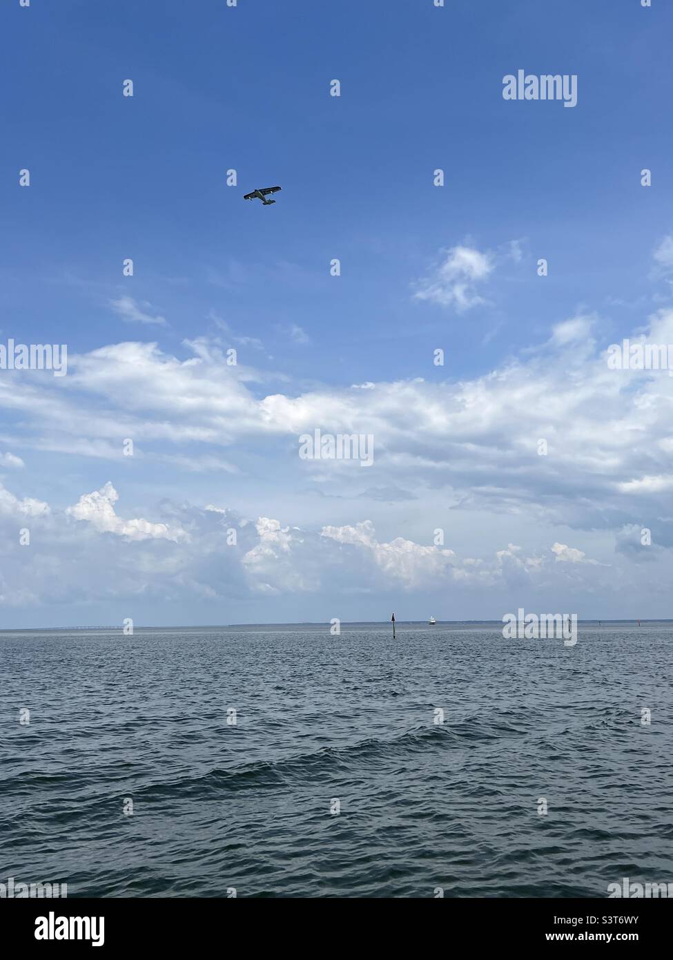 Seaplane flying over the Gulf of Mexico Stock Photo
