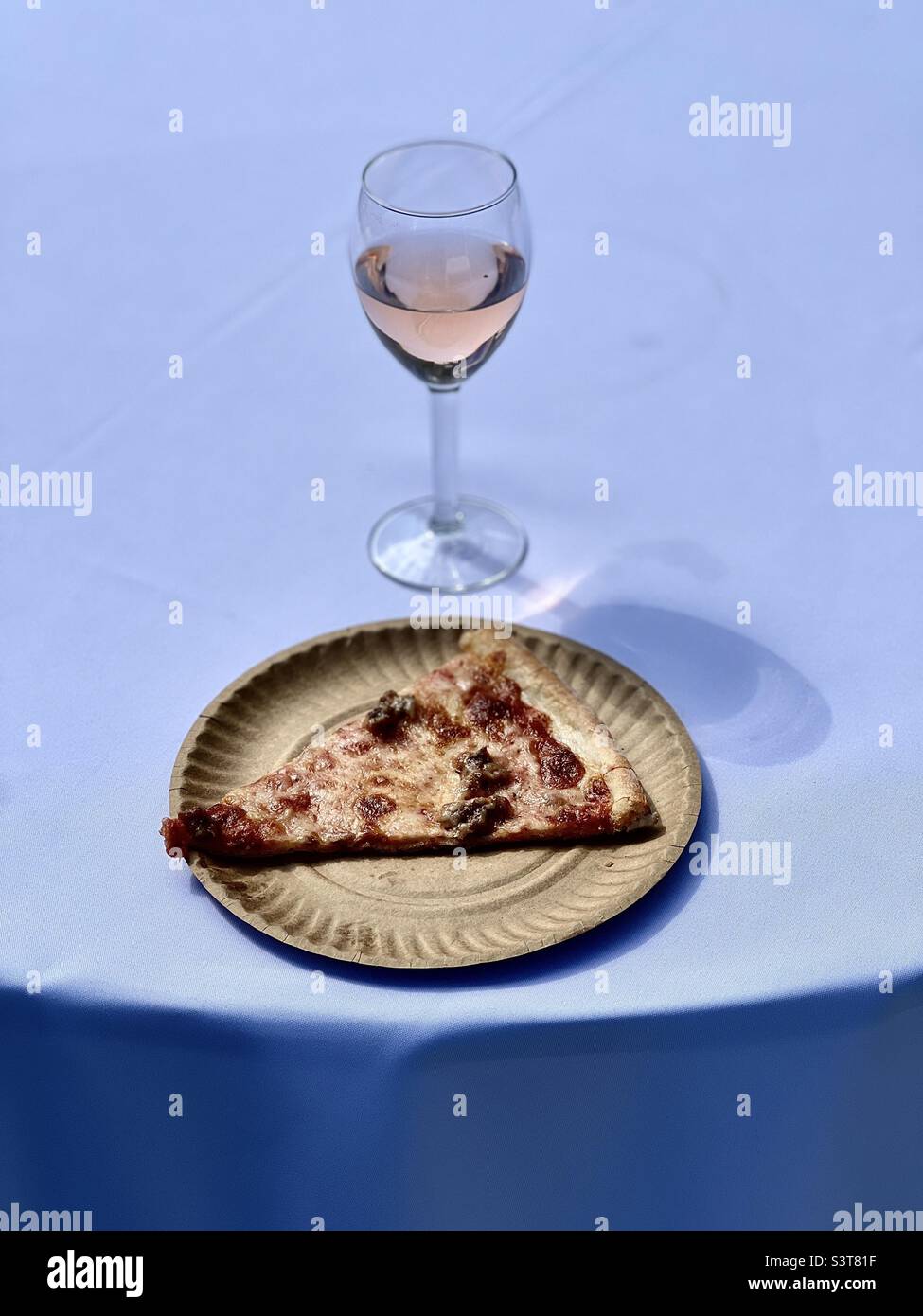 Outdoor art event serving sausage pizza and rosé wine - Smartphone Captured Stock Image