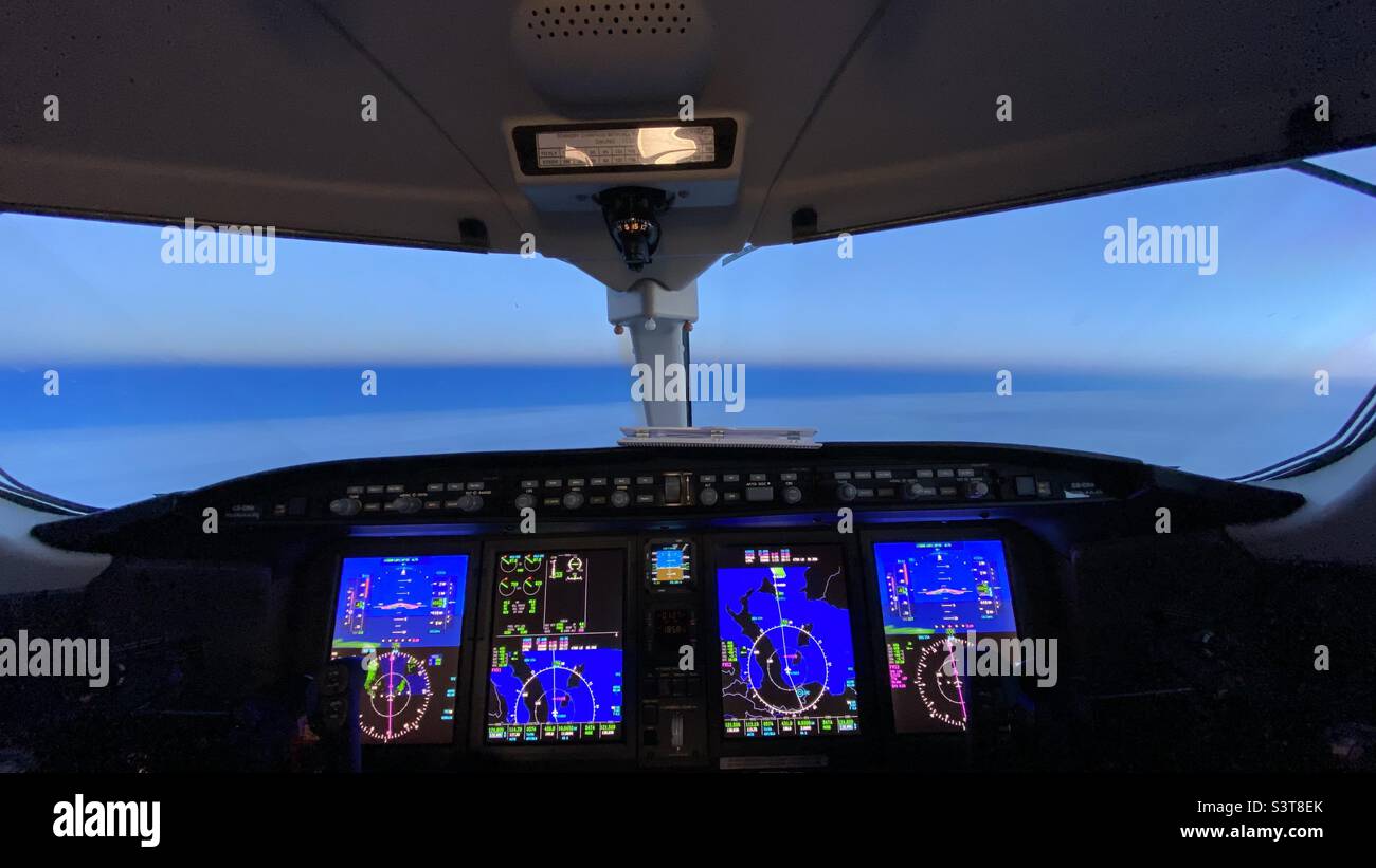 Modern glass cockpit of bombardier business jet Stock Photo