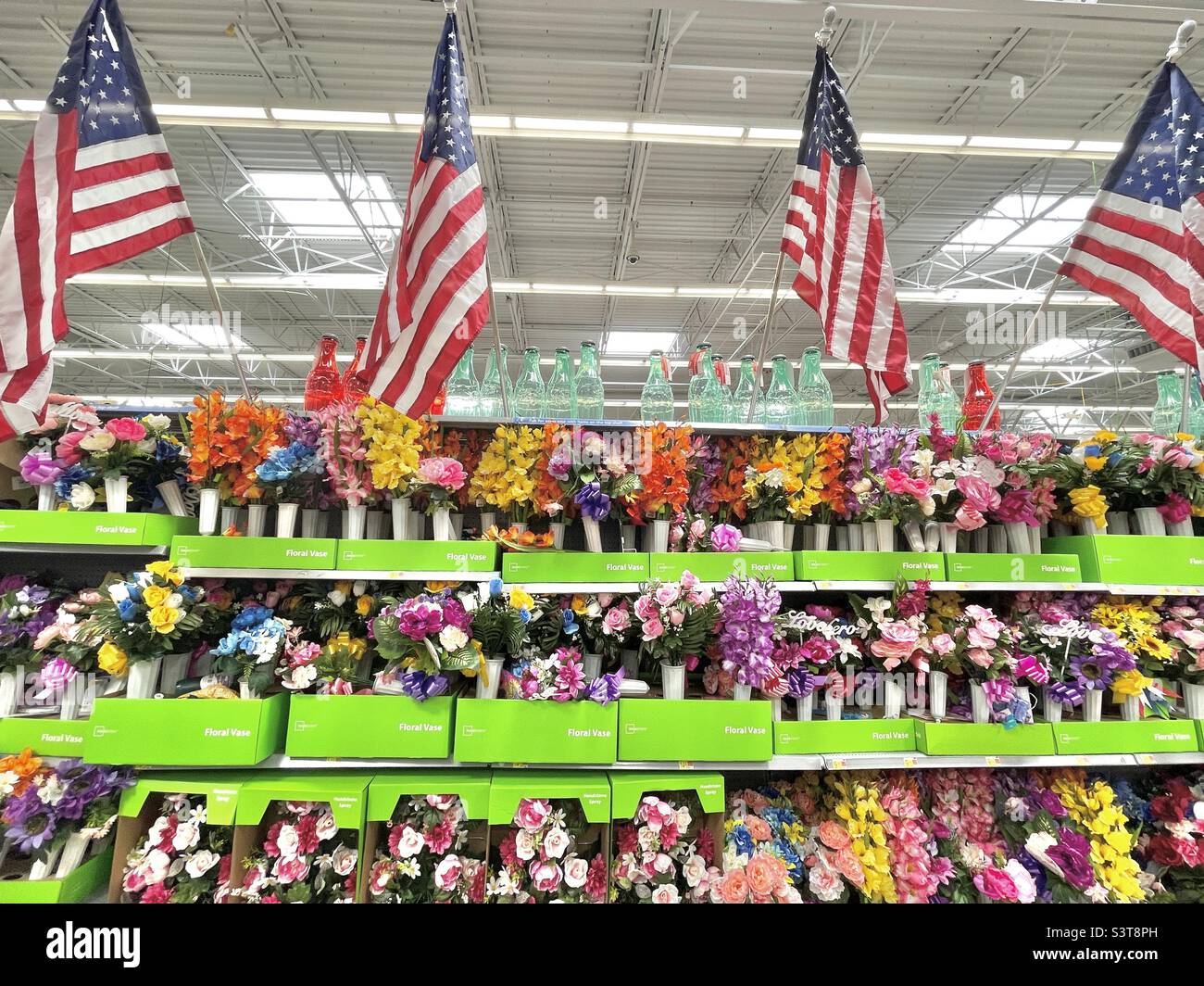 An aisle of goods for sale at a local Walmart in Utah, USA just before the summer holiday season begins with Memorial Day. - Smartphone Captured Stock Image