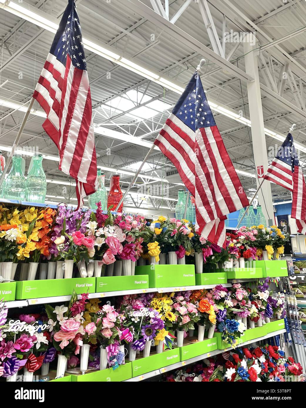 An aisle of goods for sale at a local Walmart in Utah, USA just before the summer holiday season begins with Memorial Day. - Smartphone Captured Stock Image