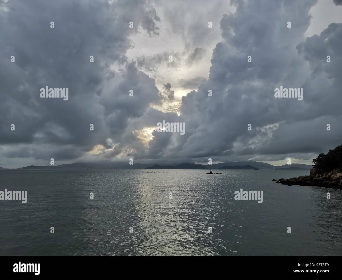 Menacing clouds over the West Lamma channel in Hong Kong. - Smartphone Captured Stock Image