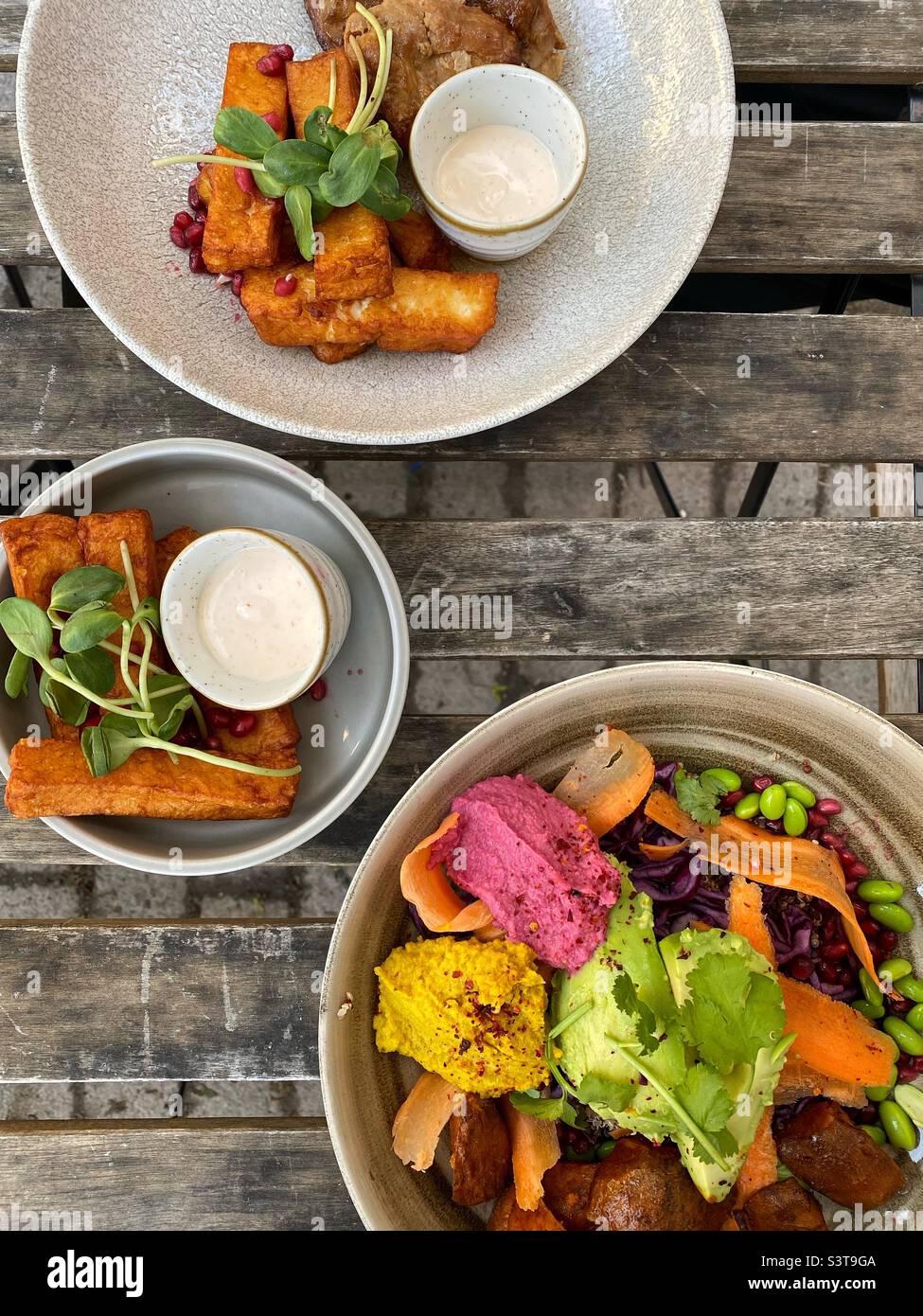 Food plates and vegetarian bowl Stock Photo