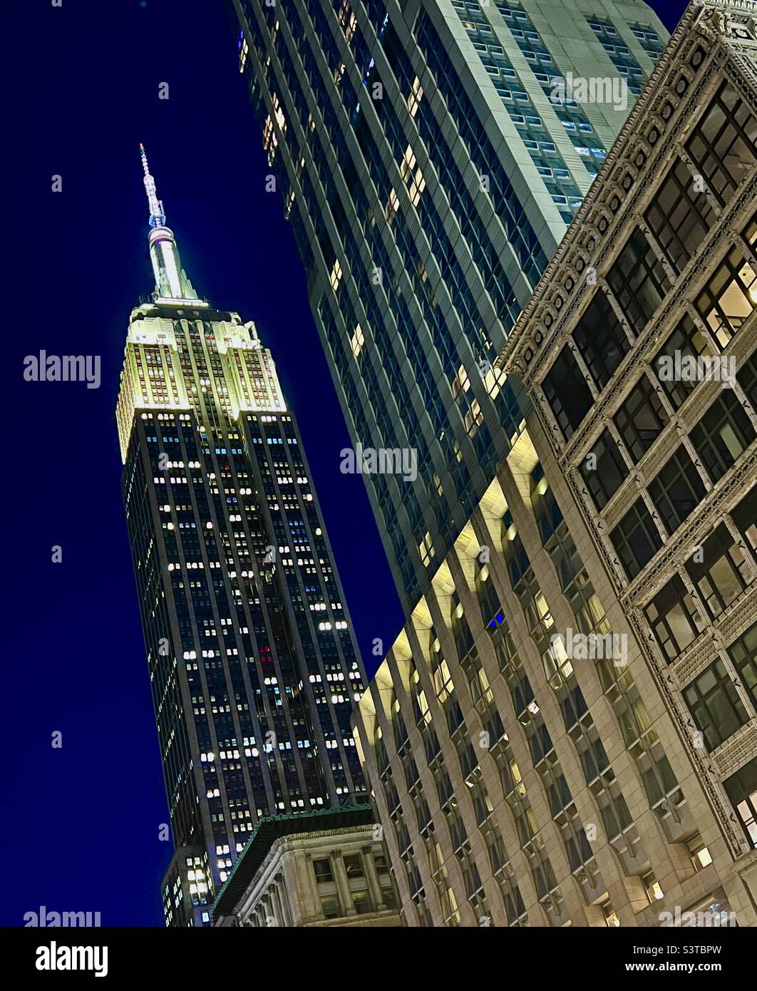 Empire State Building at nigh in blue hour Stock Photo