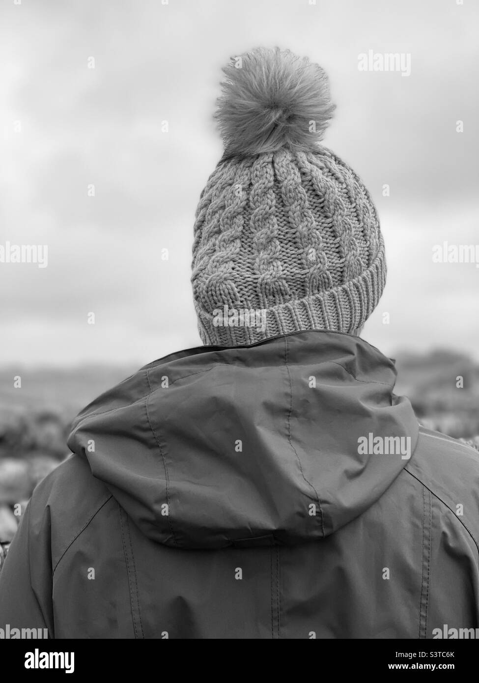 Rear view of woman wearing a knit hat Stock Photo