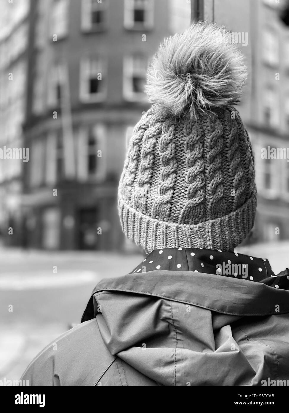 Rear view of woman wearing a knit hat Stock Photo