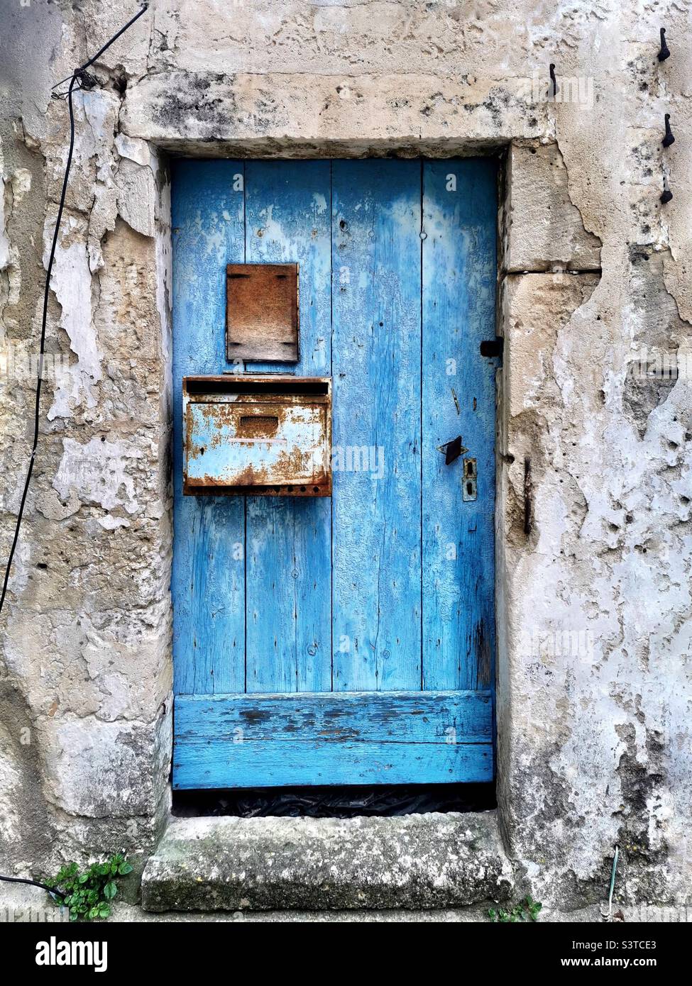 blue wooden door in Camargue Stock Photo