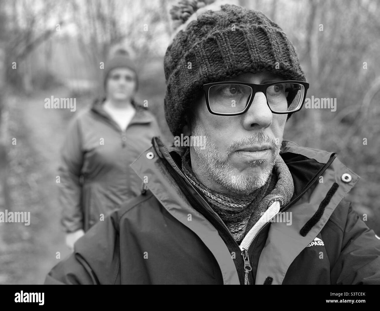 People walking in winter wearing knit hat Stock Photo