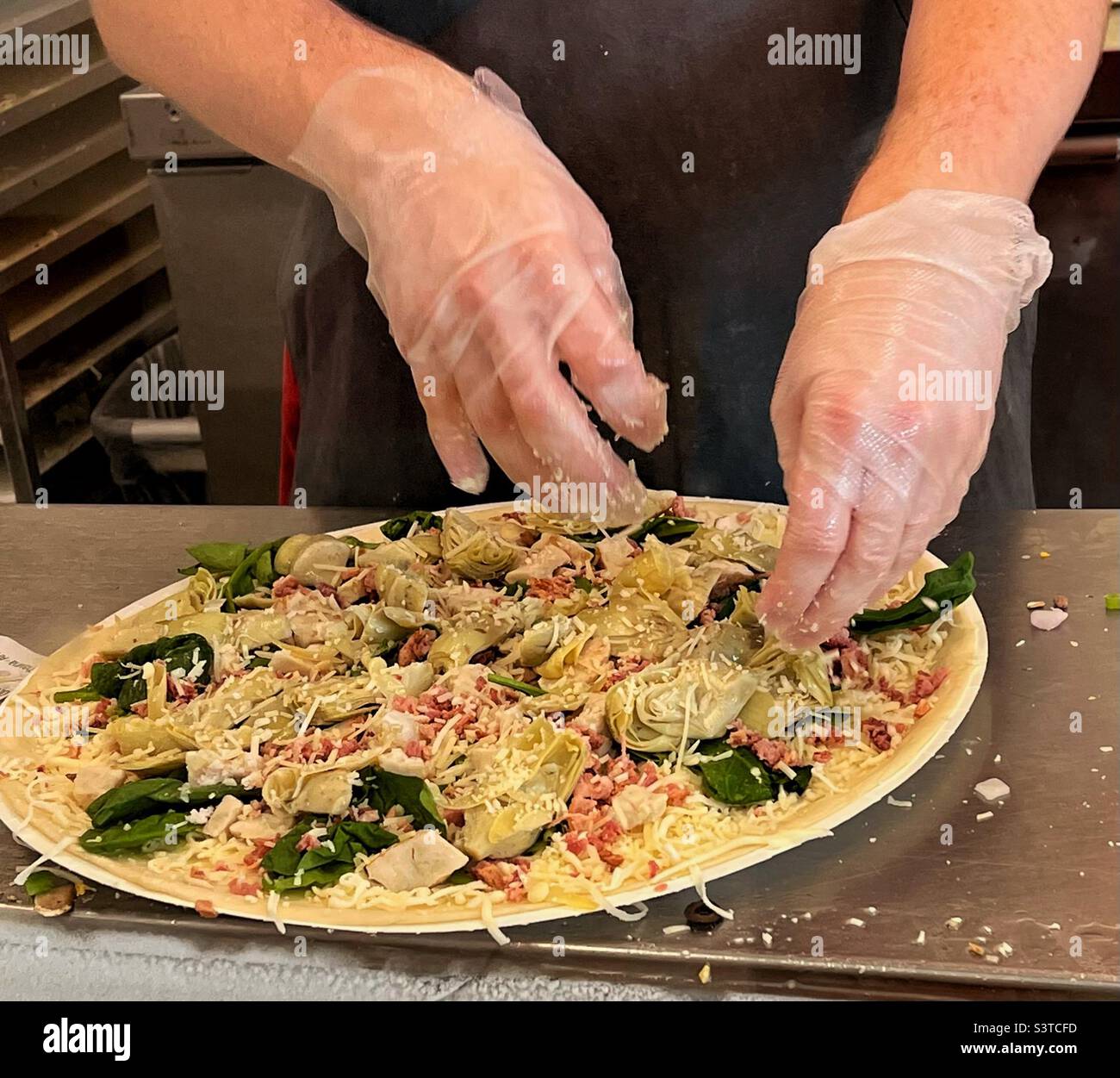 Creating a masterpiece with pizza stock photo alamy