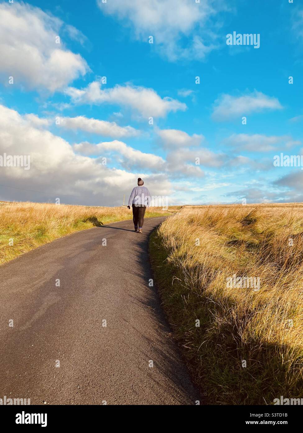 One person walking in the countryside Stock Photo