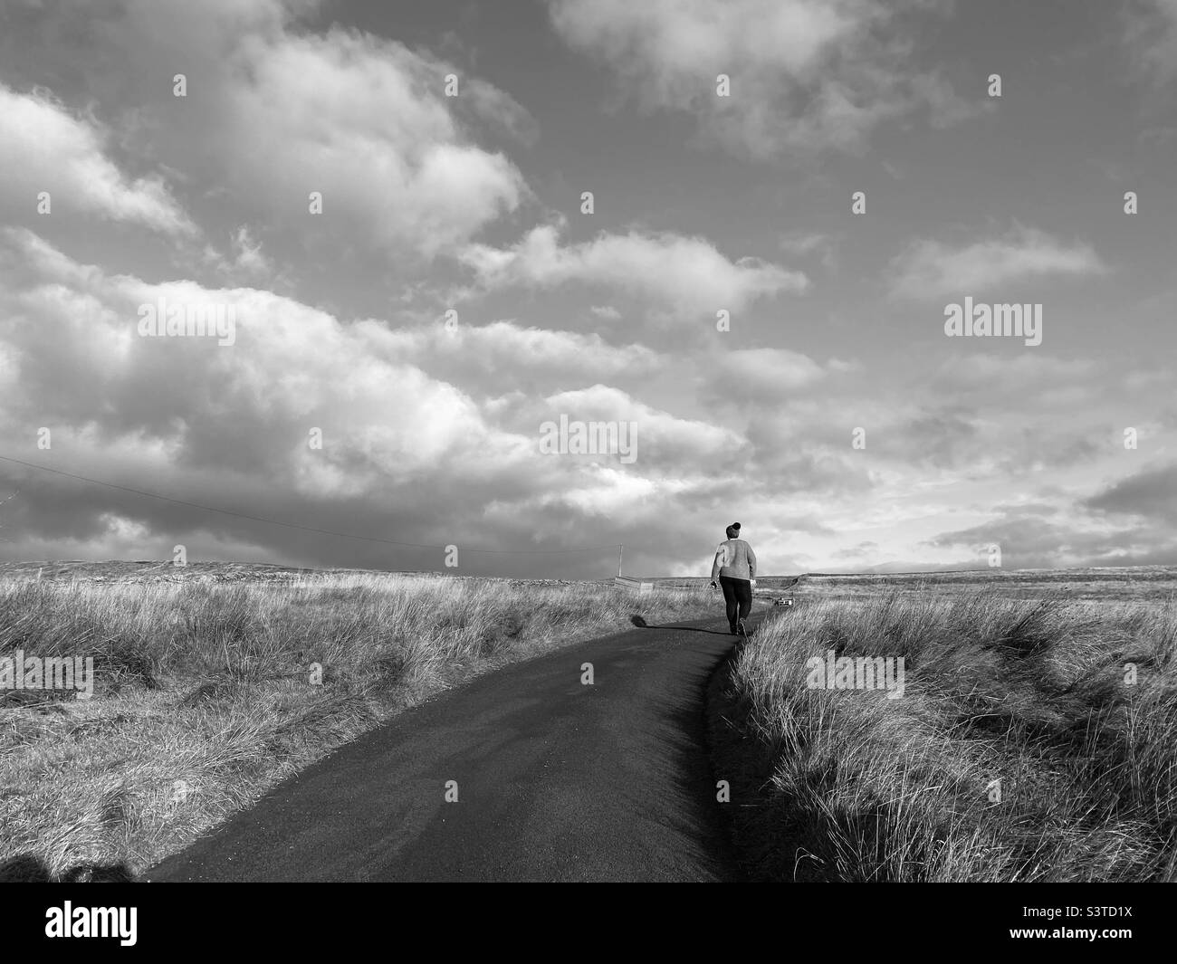 Woman walking in the countryside Stock Photo