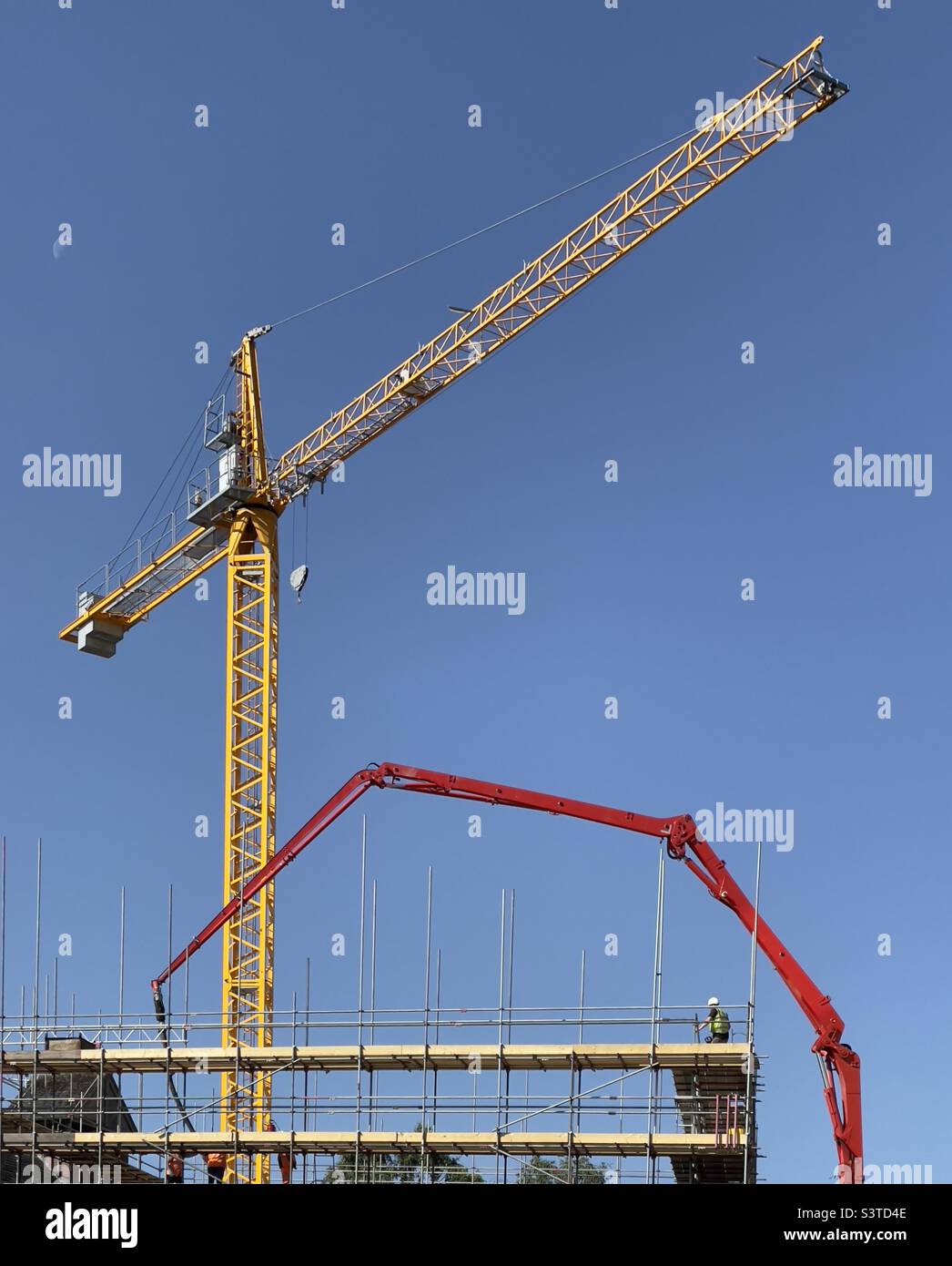 Two cranes on a building site adjacent to The Hive in Worcester UK - Smartphone Captured Stock Image